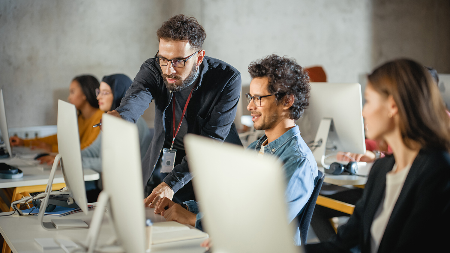 Professionals working on laptops